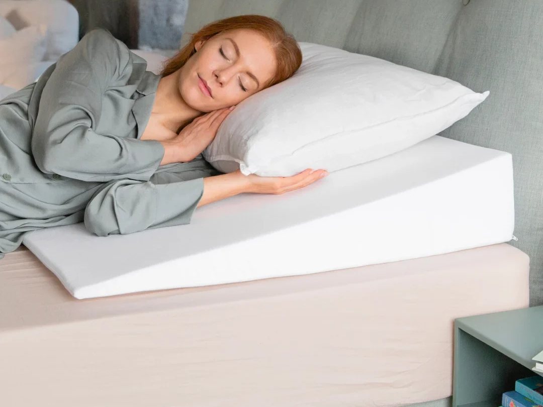 Woman sleeping on a Putnams bed wedge