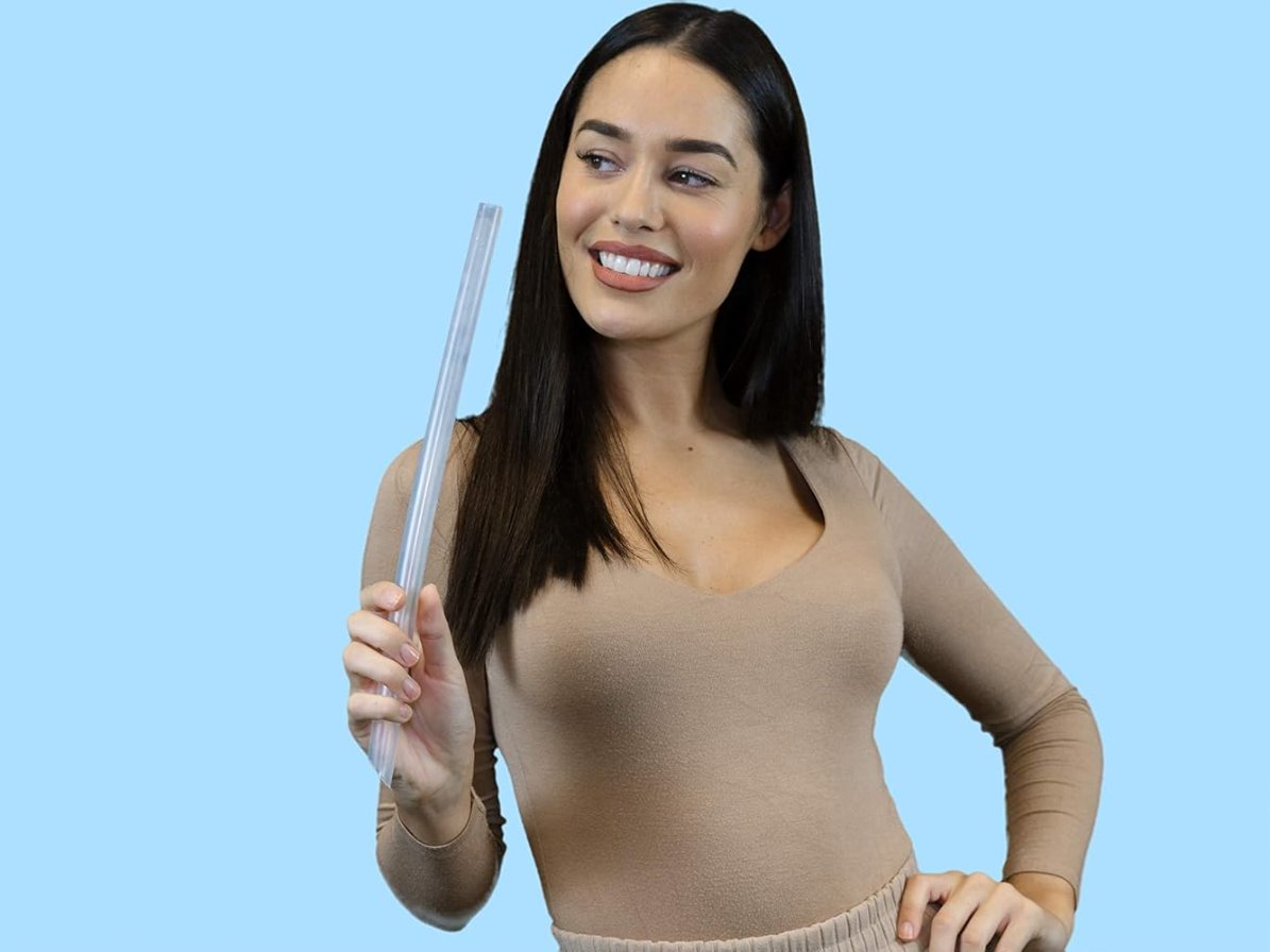 Singer holding a clear silicone Vocal Tube